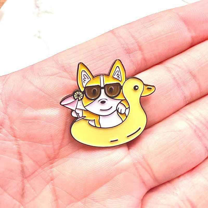 Corgi Floaty enamel pin with yellow duck floatie and sunglasses on Tampa Home & Garden Store