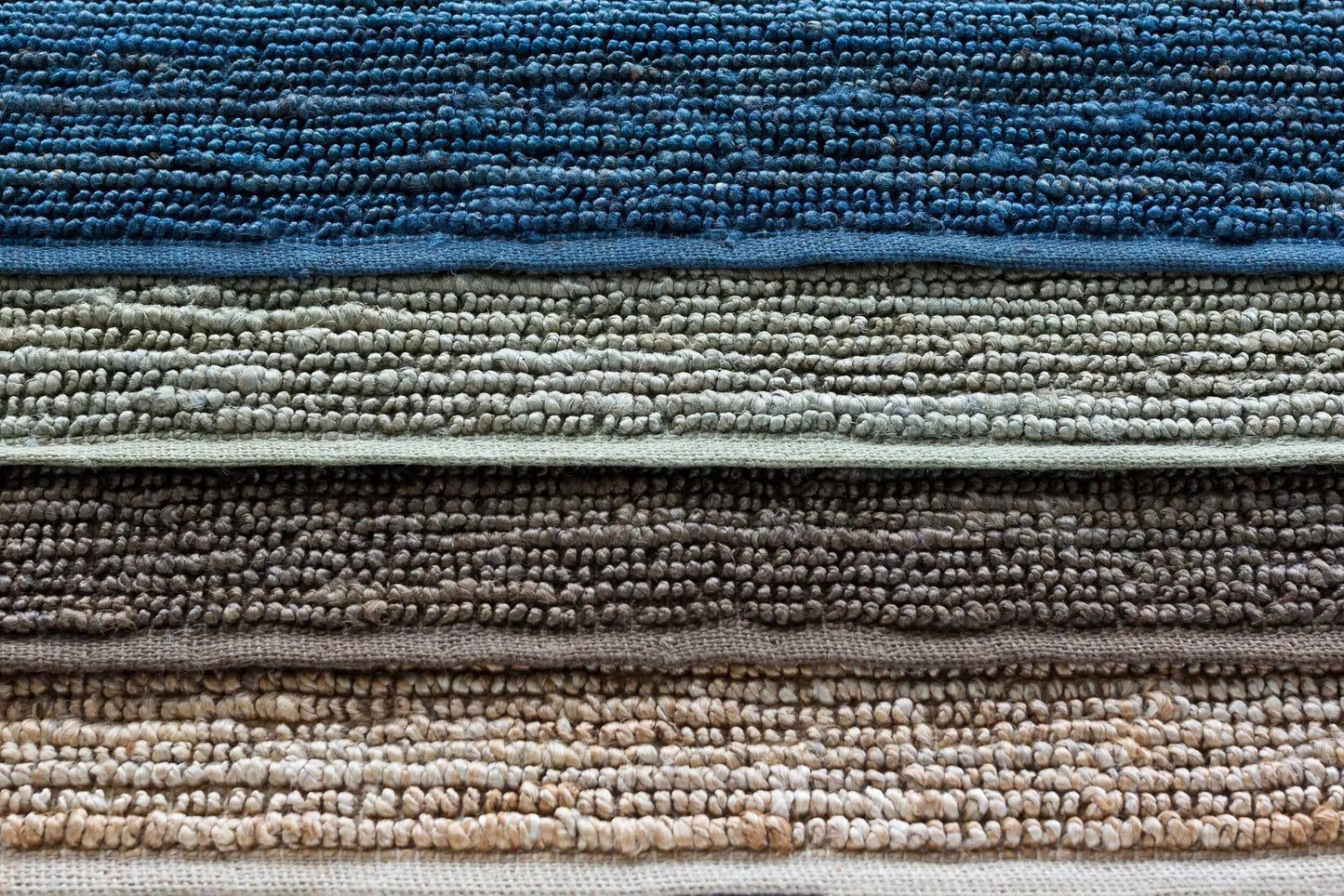 Glover Bleached Braided Jute Carpet rug stacked in blue gray taupe and beige tones on Tampa Home & Garden Store