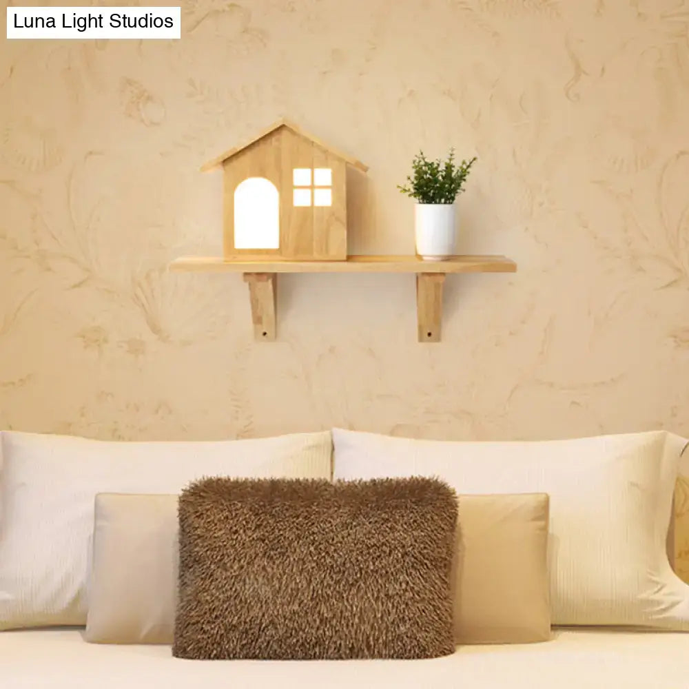 Wood wall sconce by Decorbites with house lantern silhouette on a wooden shelf on Tampa Home & Garden Store