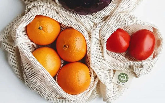 Mesh Produce Bags in natural cotton mesh holding oranges and tomatoes Organic Cotton Mart on Tampa Home & Garden Store