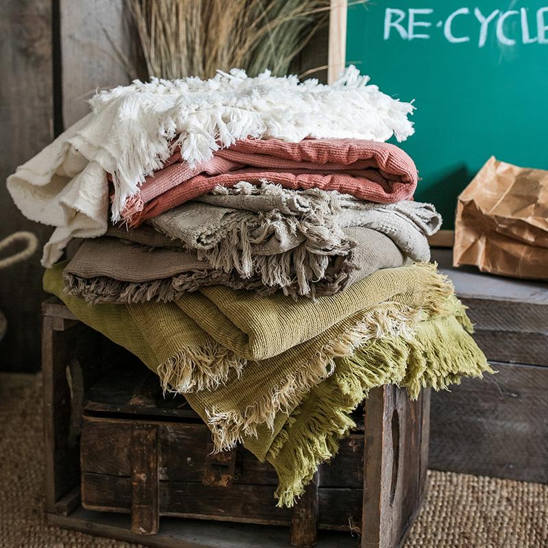 Cotton Throw Blanket RusticReach in white pink gray olive a stack with fringe on crate on Tampa Home & Garden Store