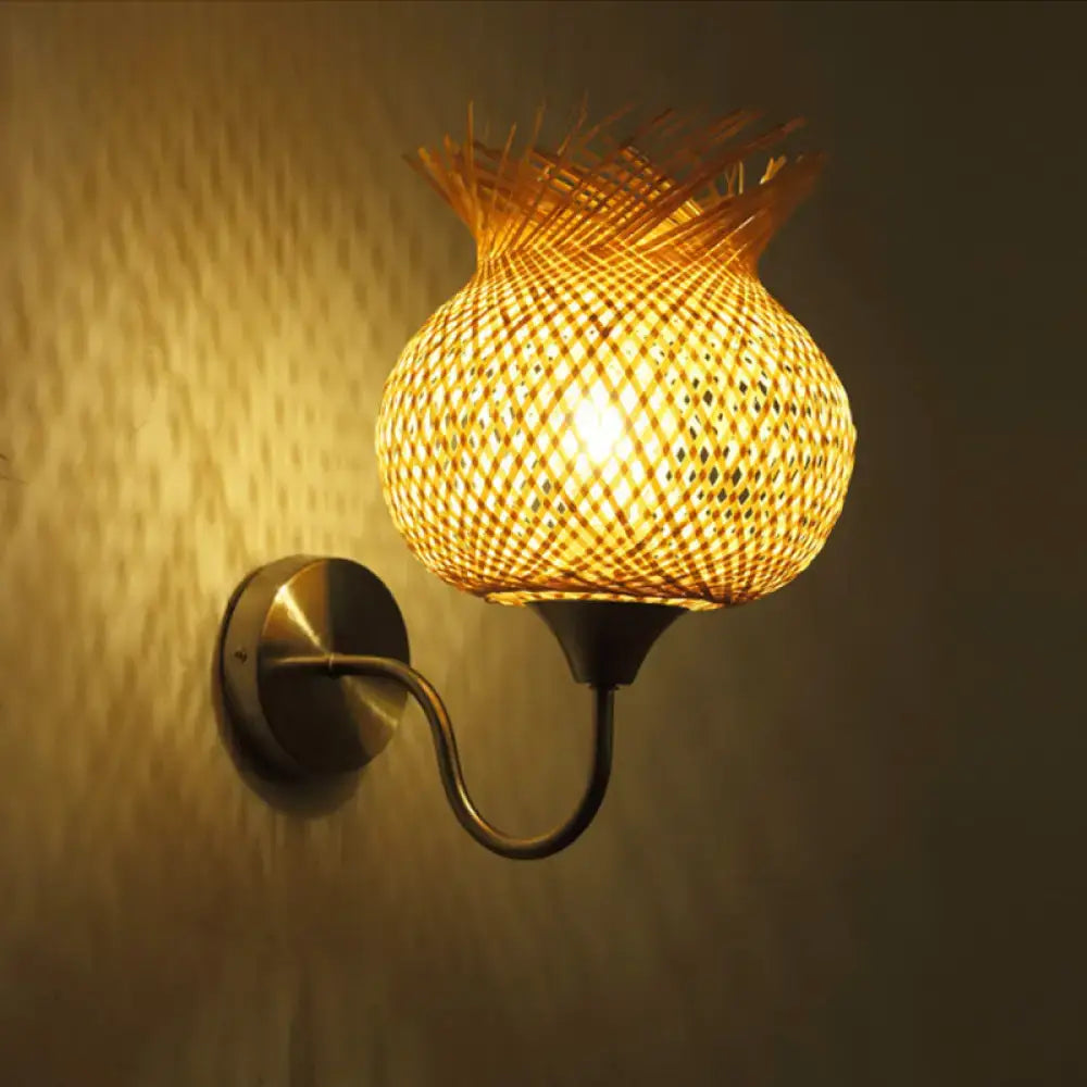 Beige rattan wall sconce by Decorbites; woven basket shade with warm amber glow on Tampa Home & Garden Store