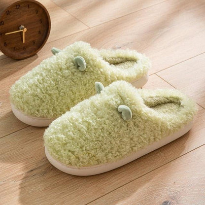 Pair of mint-green plush fur slippers with fluffy interior and white sole on Tampa Home & Garden Store