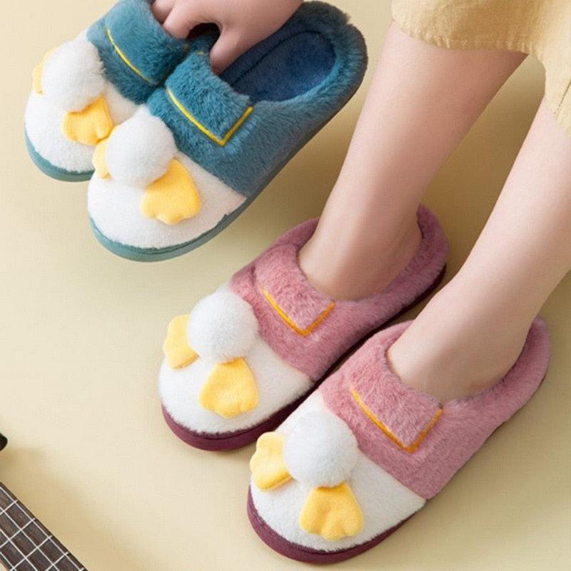 Stevvex plush fur slippers for couples, pink and blue fuzzy house slippers with yellow bows on Tampa Home & Garden Store
