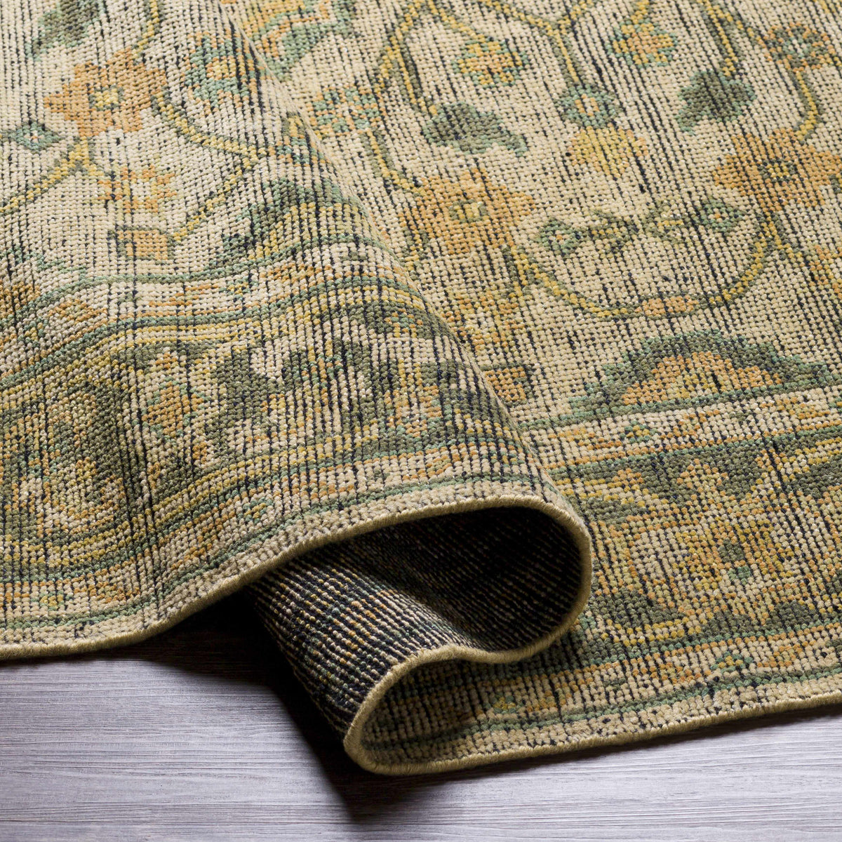 Coylton Area Rug close-up in beige olive and gold tones with floral motif on Tampa Home & Garden Store