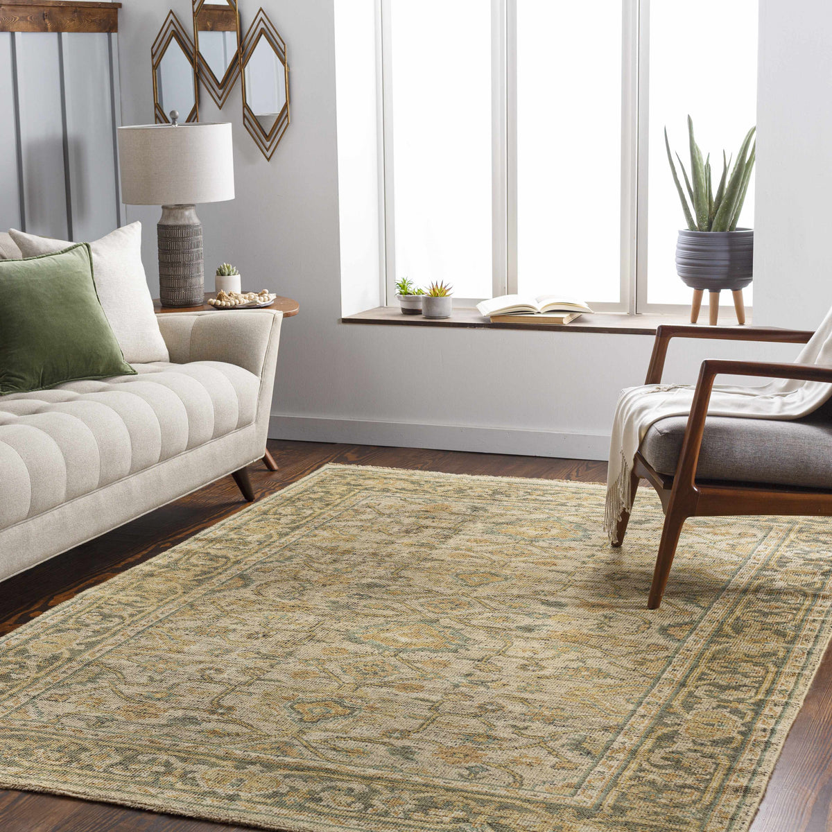Coylton Area Rug by Boutique Rugs, beige distressed rug with green and blue border on Tampa Home & Garden Store