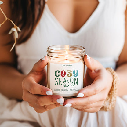 Candle Cozy Season by Gia Roma in a clear glass jar with a glowing wick, soy wax on Tampa Home & Garden Store