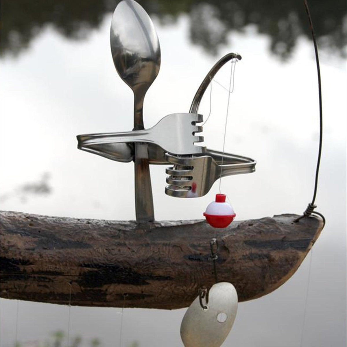 Wind chime spoon fish sculpture in silver metal with hanging buoy decor for yard garden on Tampa Home & Garden Store