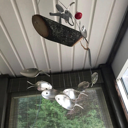 Creative Fishing Man Spoon Fish Wind Chime with rustic log centerpiece and fish accents on Tampa Home & Garden Store