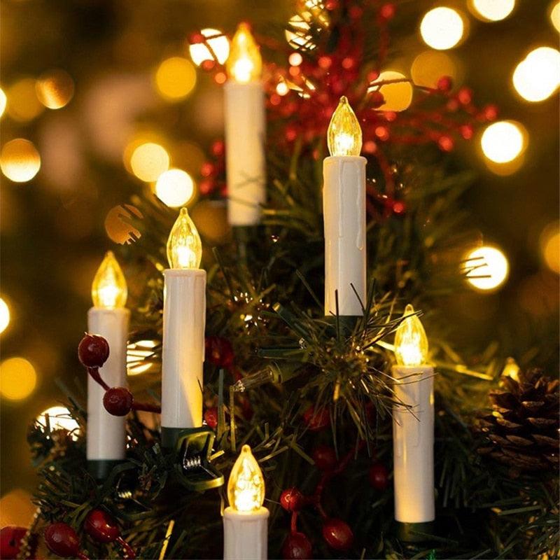Flameless LED candles white plastic on Christmas tree with warm yellow flames, six candle lights on Tampa Home & Garden Store