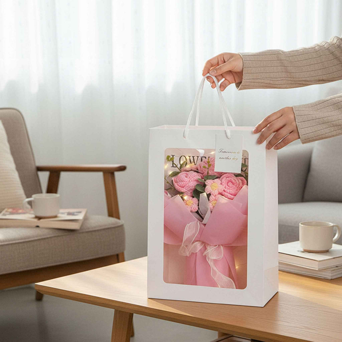 Crochet Rose Bouquet with LED Light in a white gift bag featuring pink floral artwork on Tampa Home & Garden Store