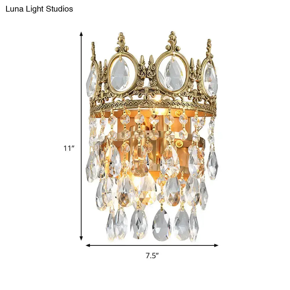 Crown aged-brass wall sconce with crystal prisms, chandelier-style bedroom lighting 11in tall on Tampa Home & Garden Store