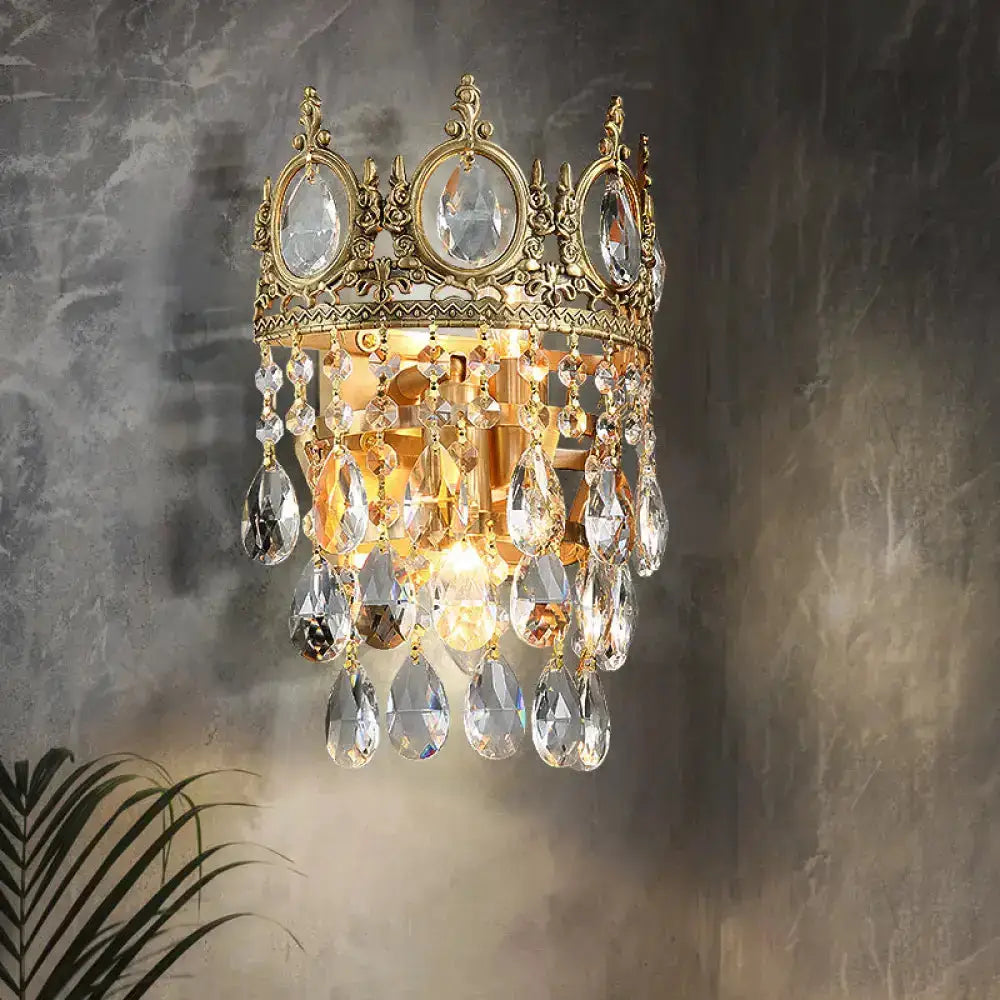 Crown aged brass wall sconce with clear crystal prisms by Decorbites for bedroom on Tampa Home & Garden Store