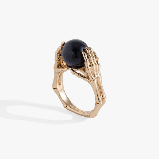 Crystal Ball Ring by ALEX AND ANI with a dark blue speckled globe held by gold skeletal hands on Tampa Home & Garden Store