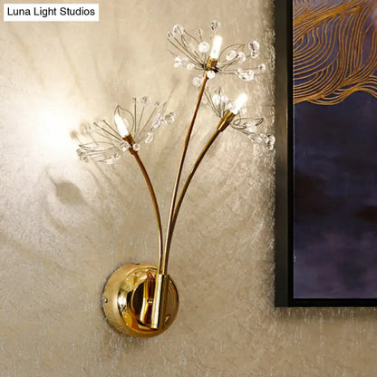 Gold dandelion wall sconce with three LED bulbs and crystal accents on round gold mount on Tampa Home & Garden Store
