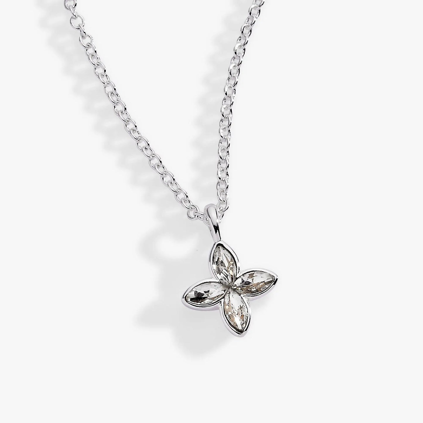 Crystal Logo Star Necklace with a silver chain and four-petal crystal flower pendant on Tampa Home & Garden Store