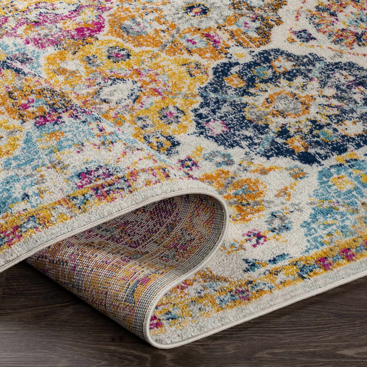 Custar Colorful Area Rug by Boutique Rugs, vibrant abstract pattern in yellow pink blue tones on Tampa Home & Garden Store