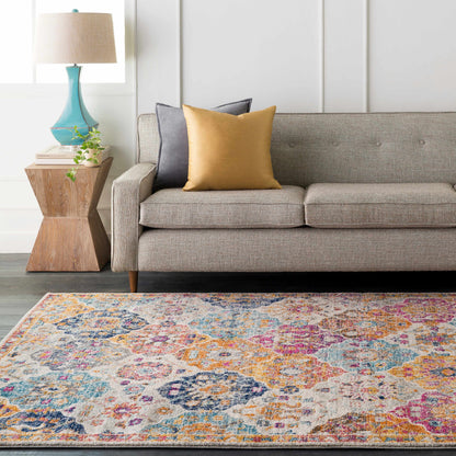 Custar Colorful Area Rug multicolor abstract design under a sofa with mustard pillow on Tampa Home & Garden Store