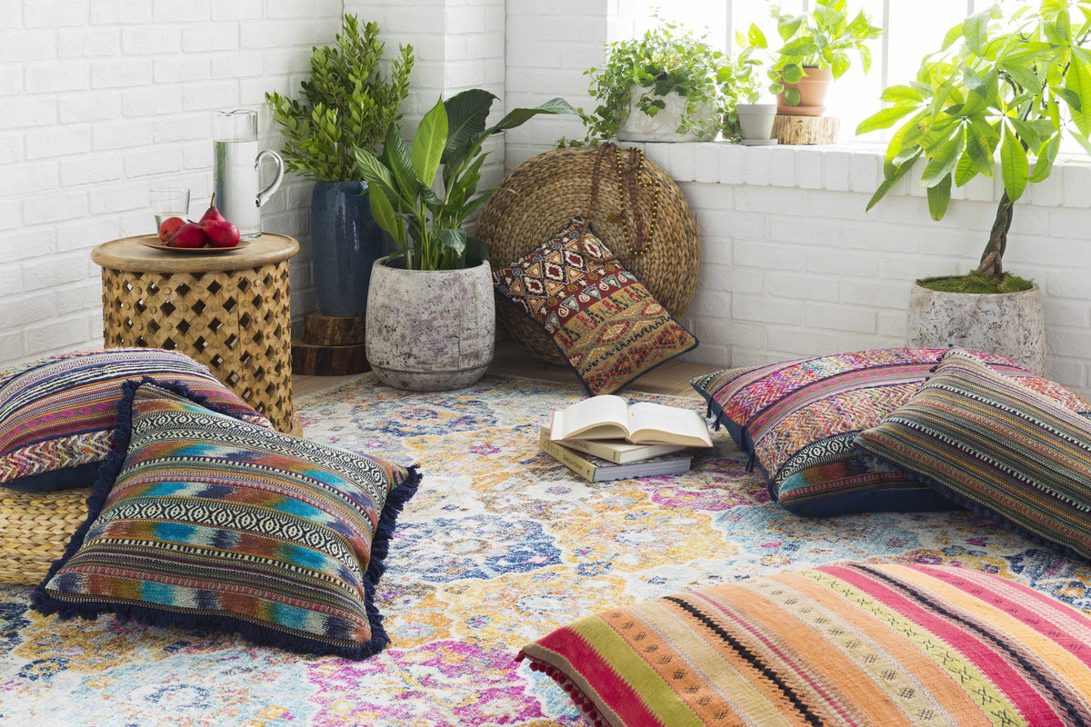 Custar Colorful Area Rug, vibrant multicolor woven rug in a sunlit plant-filled room on Tampa Home & Garden Store