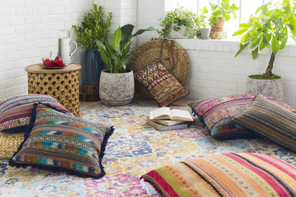 Custar Colorful Area Rug, vibrant multicolor woven rug in a sunlit plant-filled room on Tampa Home & Garden Store