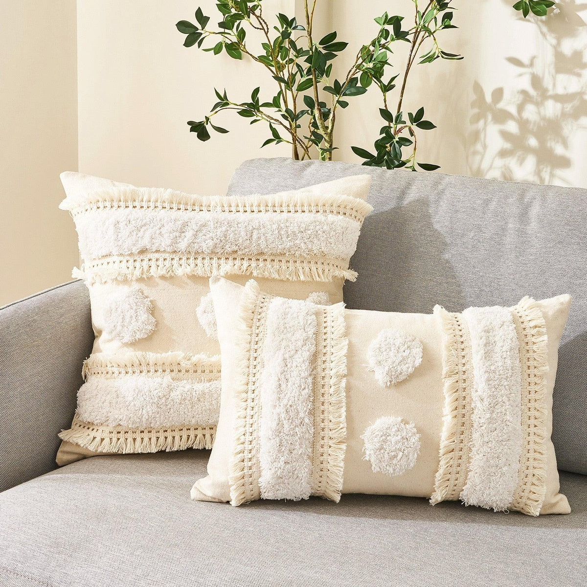 Cushion covers set of 3 beige cotton-linen with tufted fringe and tassel trim on a sofa on Tampa Home & Garden Store