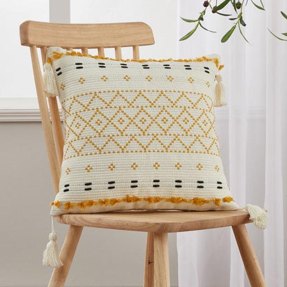 Cushion cover Stevvex cotton linen tufted beige with tassel trim on wooden chair on Tampa Home & Garden Store
