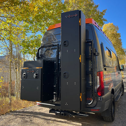 Avatar Niko Van Storage Box mounted on a heavy-duty black rack with orange accents on a cargo van on Tampa Home & Garden Store