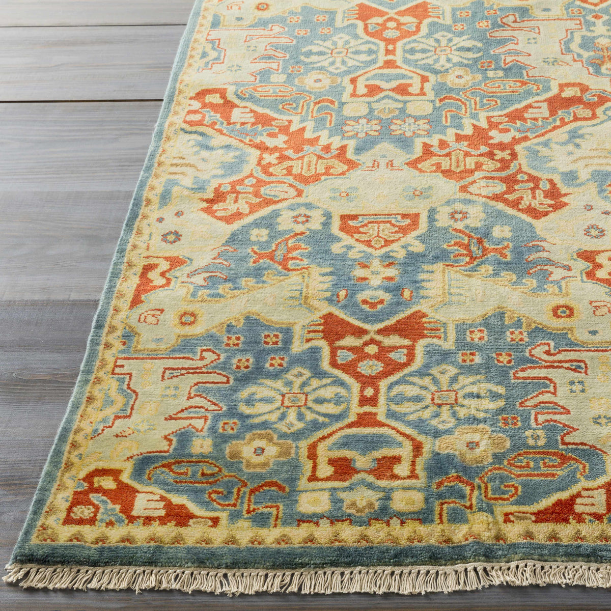 Cutler Cream/Orange Wool Runner Rug by Boutique Rugs in blue/orange with fringe on wooden floor on Tampa Home & Garden Store