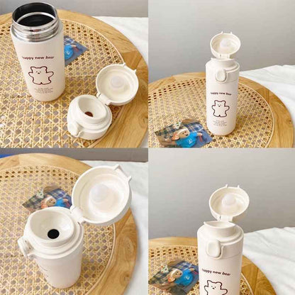Cute Bear travel flask by Shaketea, cream vacuum insulated water bottle with flip-top lid on Tampa Home & Garden Store