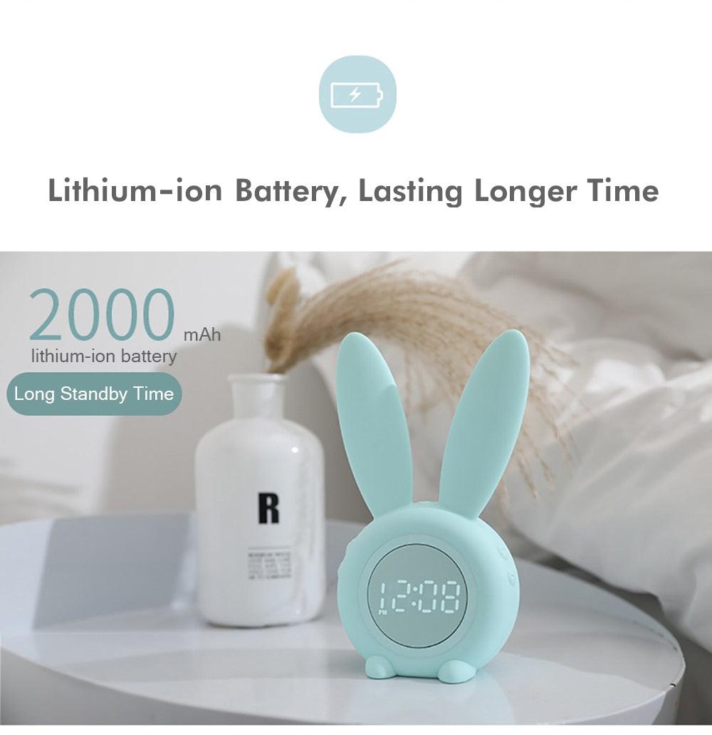Mint green bunny-ear LED alarm clock for kids with digital bedside display on a white table on Tampa Home & Garden Store