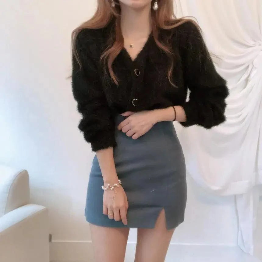 Stevvex black fuzzy knit cardigan with V-neck and ring buttons, paired with a blue mini skirt on Tampa Home & Garden Store
