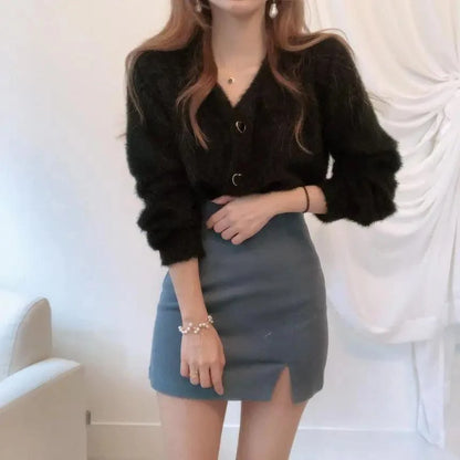 Stevvex black fuzzy knit cardigan with V-neck and ring buttons, paired with a blue mini skirt on Tampa Home & Garden Store
