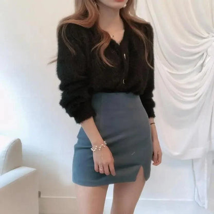 Stevvex black fuzzy knit cardigan with V-neck worn with blue mini skirt featuring front slit on Tampa Home & Garden Store