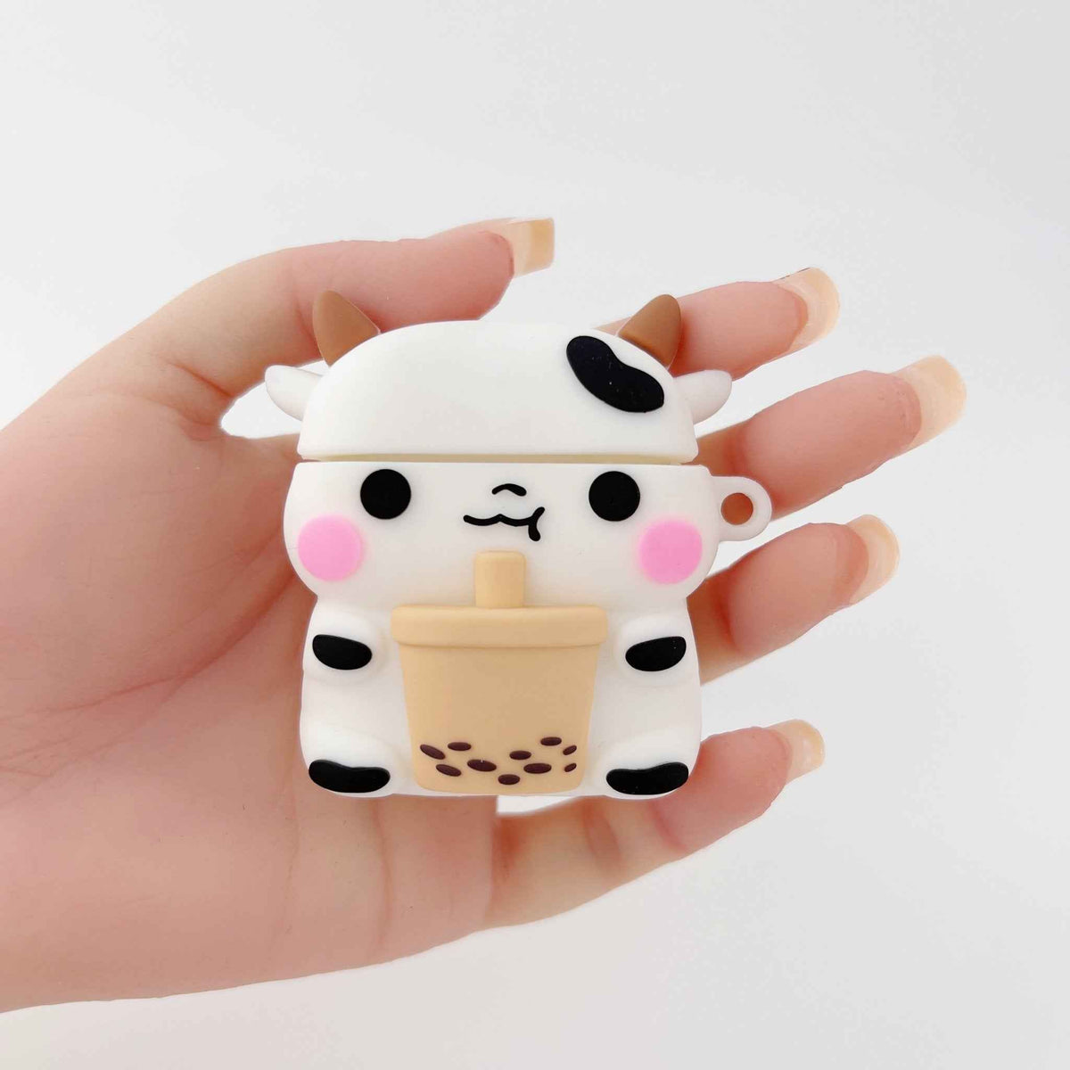 Shaketea Milk Cow Boba AirPods Case, white silicone with black spots and pink cheeks on Tampa Home & Garden Store