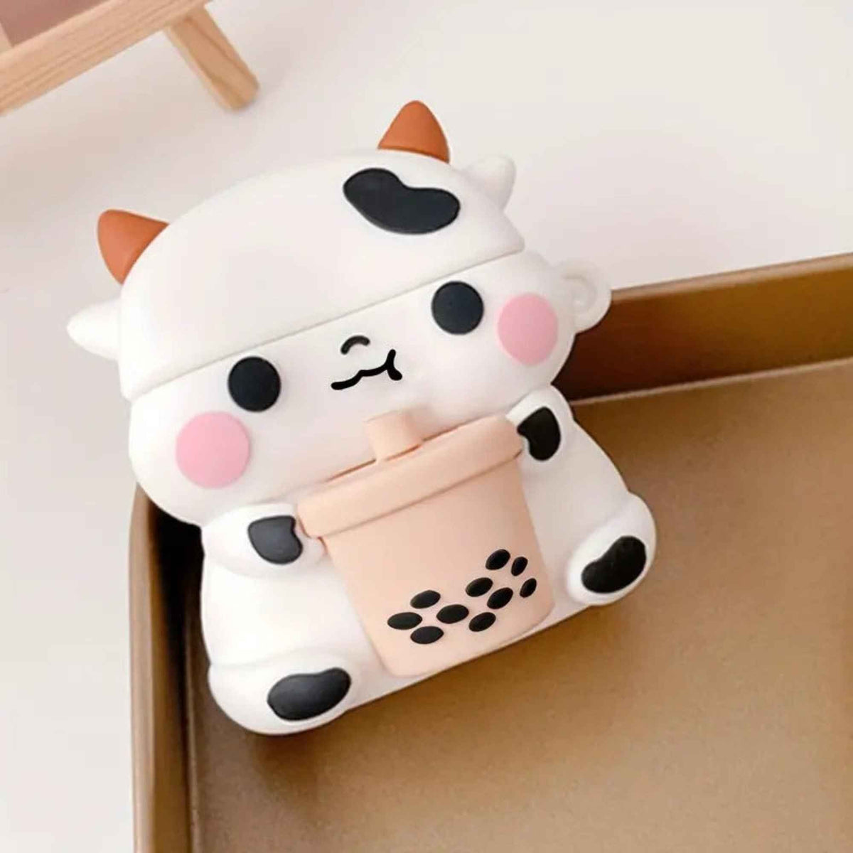 Shaketea Cute Milk Cow Boba AirPods Case silicone white with orange horns and pink cheeks on Tampa Home & Garden Store