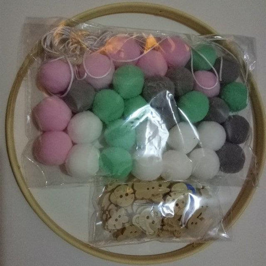 Stevvex wind chimes kit with pastel wool balls and wooden beads on a hoop on Tampa Home & Garden Store