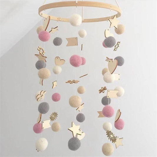 Cute wool ball wind chimes with pastel strands pink white gray pom poms and wooden stars on Tampa Home & Garden Store