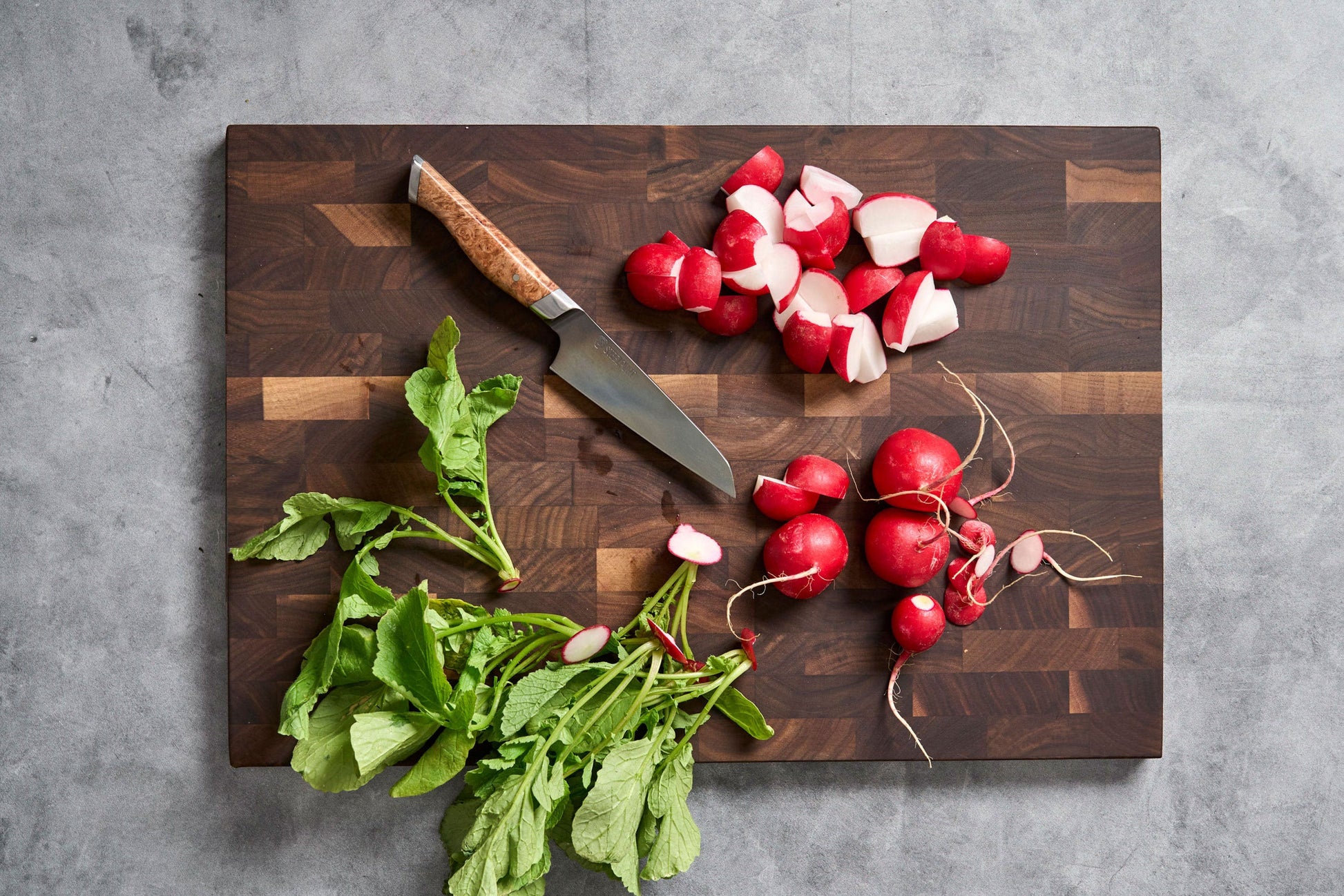 4-inch paring knife STEELPORT Knife Co. on a wooden cutting board with sliced radishes on Tampa Home & Garden Store