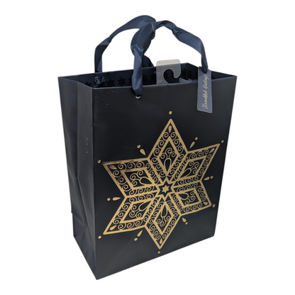 Hanukkah medium gift bag with gold Star of David motif on black, navy ribbon handles on Tampa Home & Garden Store