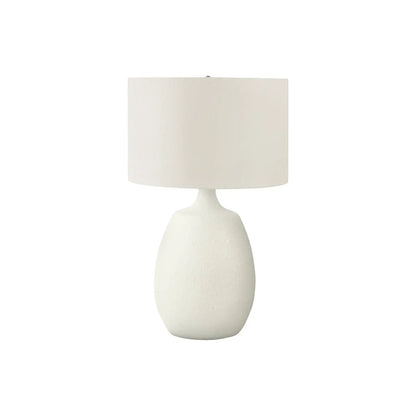 Table lamp in cream resin with a bulbous base and cream fabric drum shade on Tampa Home & Garden Store