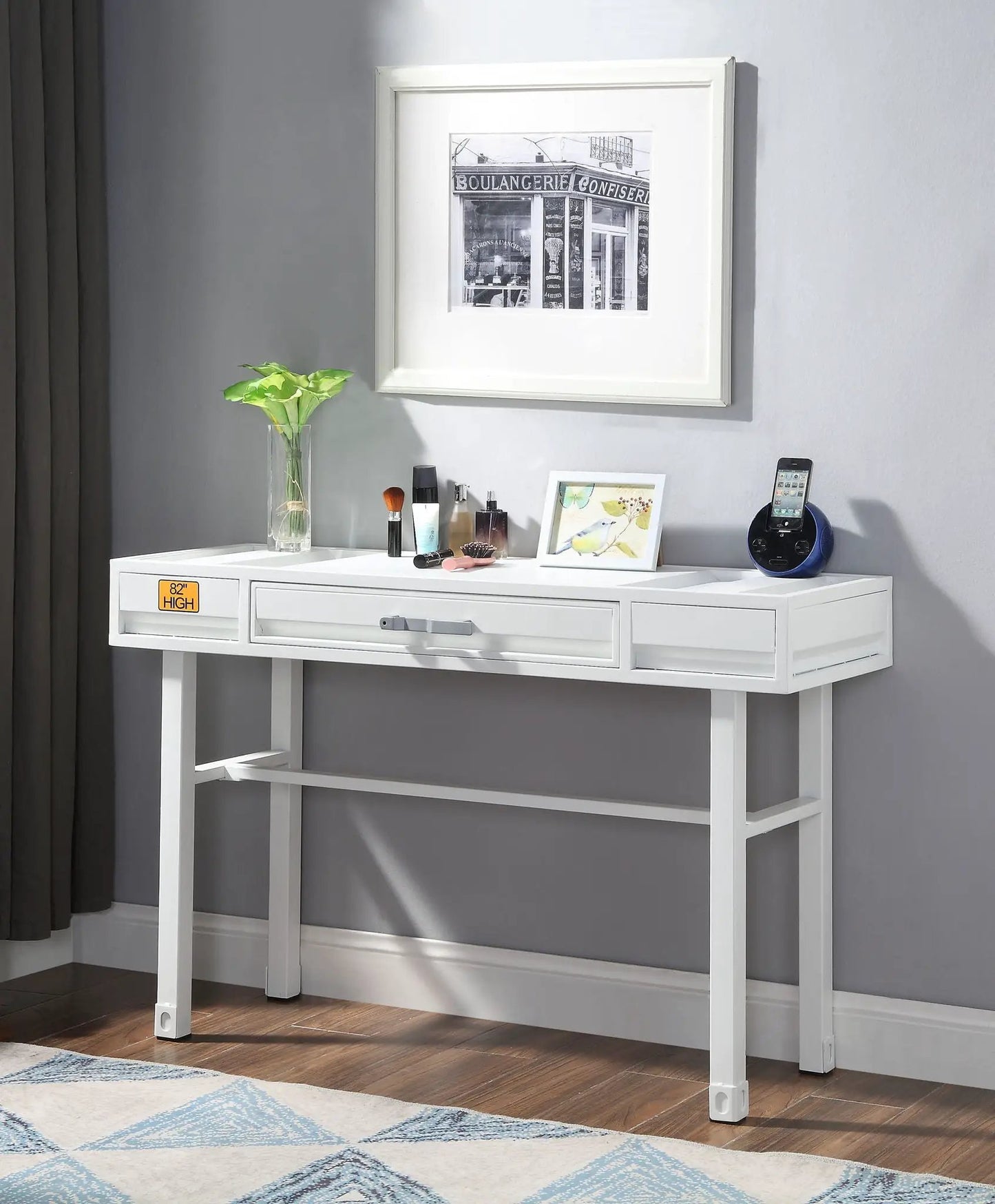 Cargo vanity desk with storage in white by Unique Piece Furniture; makeup and plant on top on Tampa Home & Garden Store
