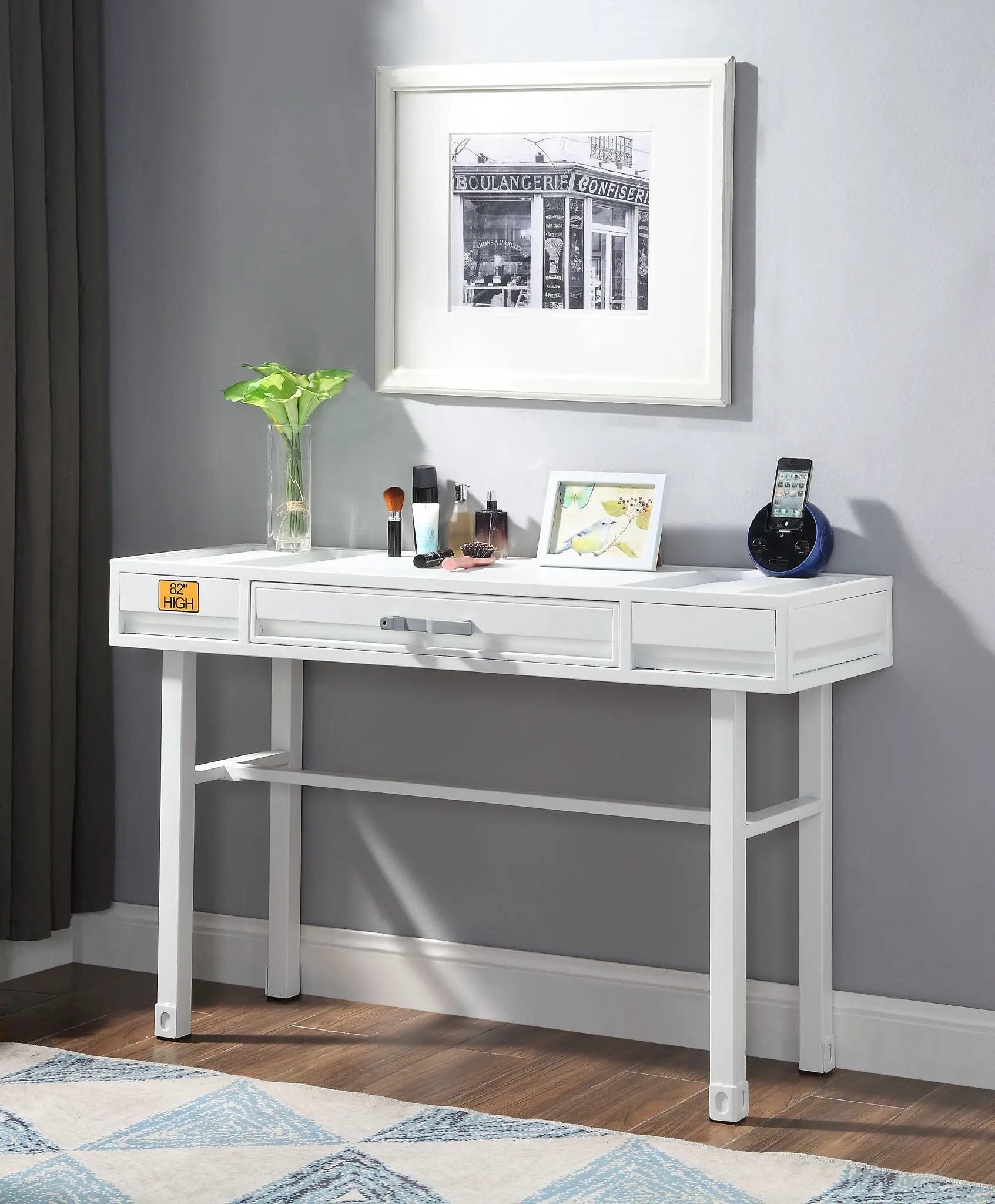 Cargo vanity desk with storage in white by Unique Piece Furniture; makeup and plant on top on Tampa Home & Garden Store