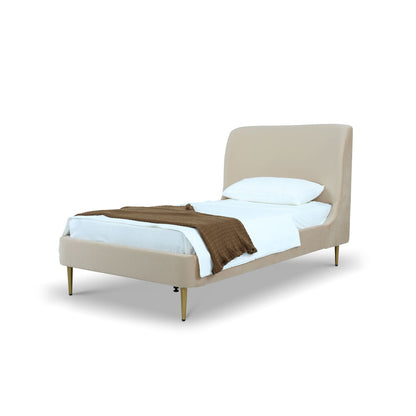 Mid-Century Modern upholstered bed with curved beige headboard and gold tapered legs on Tampa Home & Garden Store