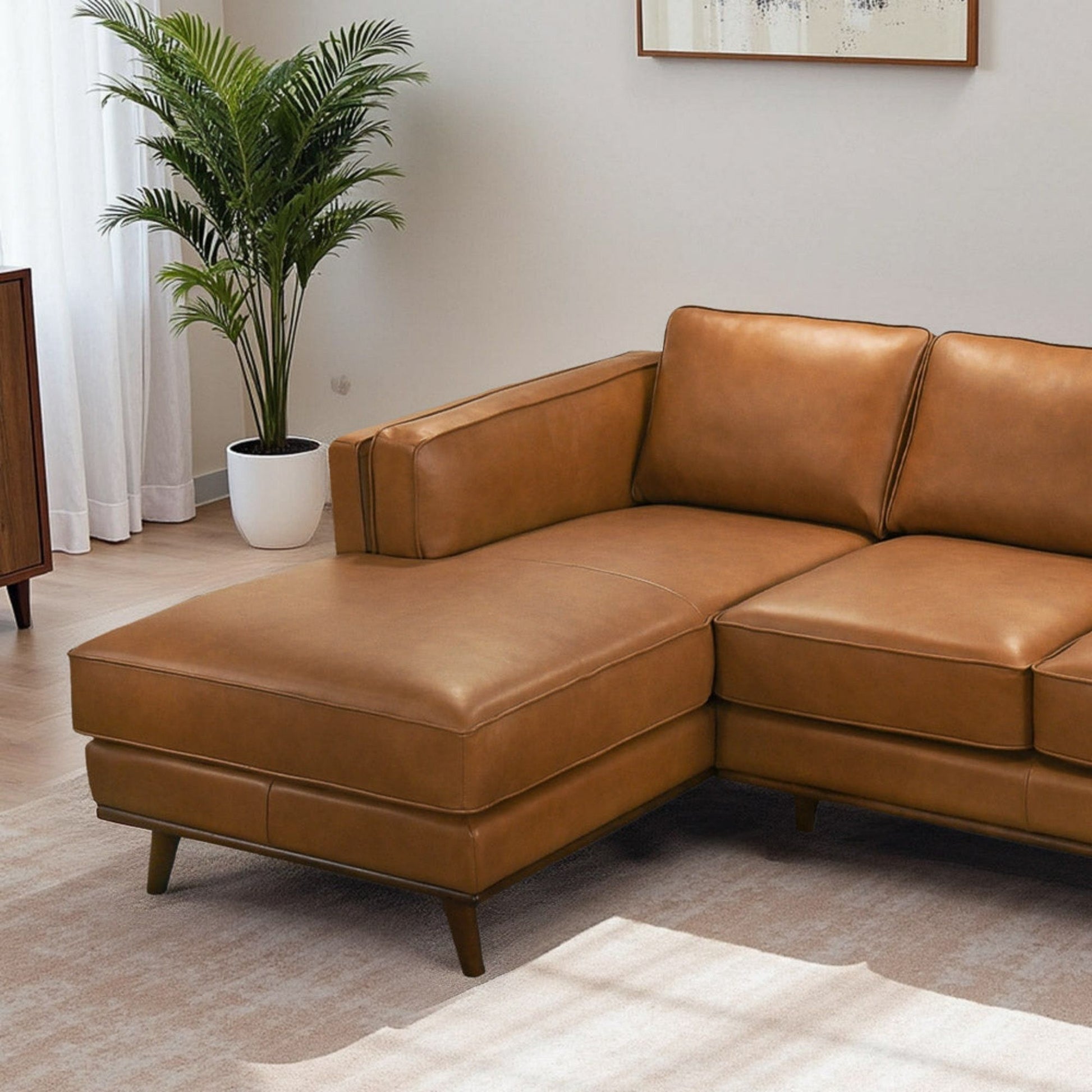 Chase sectional sofa in tan leather with sleek cushions and tapered legs on Tampa Home & Garden Store