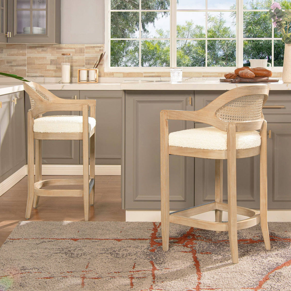 Two Mid-Century Modern cane-back counter stools in light brown wood with cream cushions HouseOfZazla on Tampa Home & Garden Store