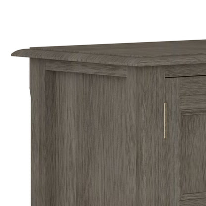 Burlington handcrafted low storage cabinet in grey wood finish with brass vertical handle on Tampa Home & Garden Store