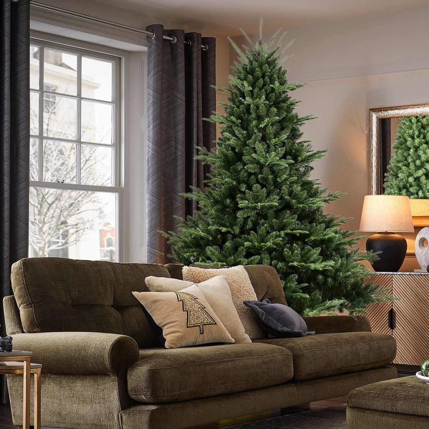 Full-shaped 6 ft Christmas tree HouseOfZazla with 1673 PE/PVC tips in room beside sofa on Tampa Home & Garden Store