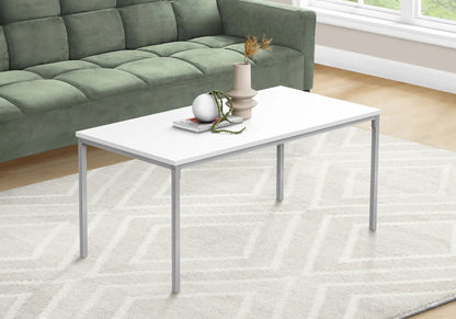 Rectangular white coffee table with slim metal legs, vase and magazines on Tampa Home & Garden Store