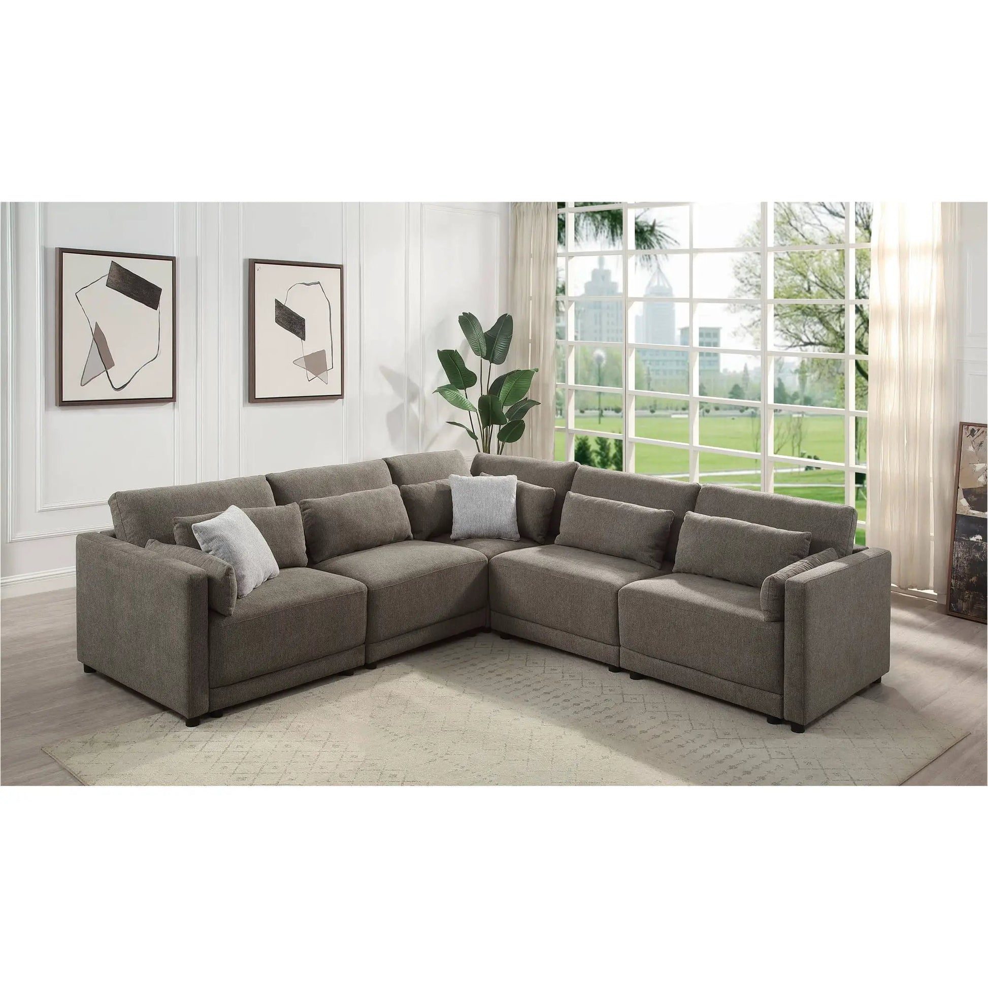 Rylie modular stationary sectional sofa with toss pillows in soft gray fabric on Tampa Home & Garden Store