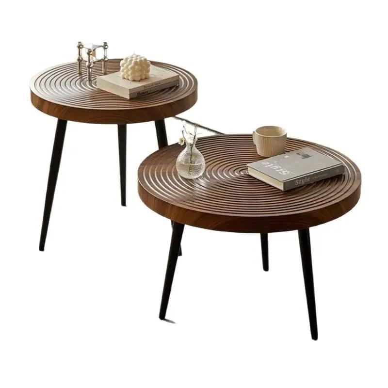 Japanese-style wood growth-ring coffee tables pair with dark brown tops and black legs on Tampa Home & Garden Store